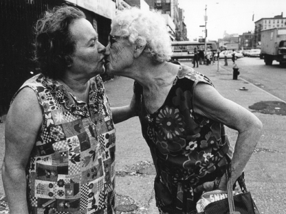 Two women kissing by Arlene Gottfried